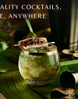 Cocktail in a gold-rimmed glass with garnish on a leaf, with text 'Bar-quality cocktails, anytime, anywhere'.