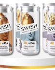 Four cans of Swish cocktails on a white stand with a gold base.