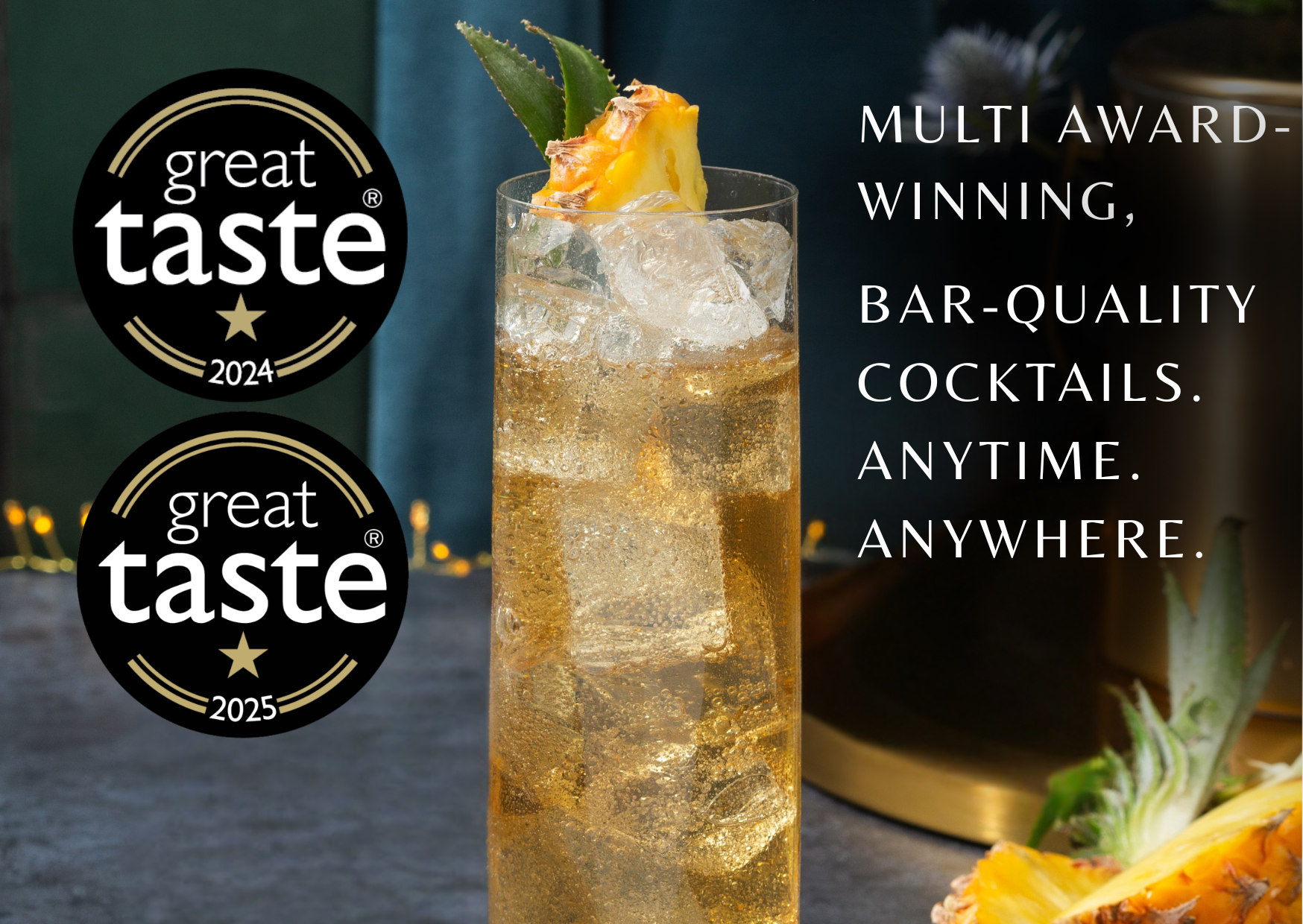 Cocktail with pineapple garnish and Great Taste awards on a dark background