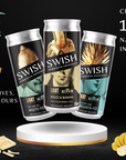 Three SWISH energy drink cans on a white stand with ingredients and a dessert on a black background.