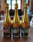 SWISH Gold Range 12% Alc Vol 750ml bottles featuring Naughty Passion Martini Spritz, Pina Colada Spritz, and Brazilian Lime Margarita Fizz premium sparkling cocktails.